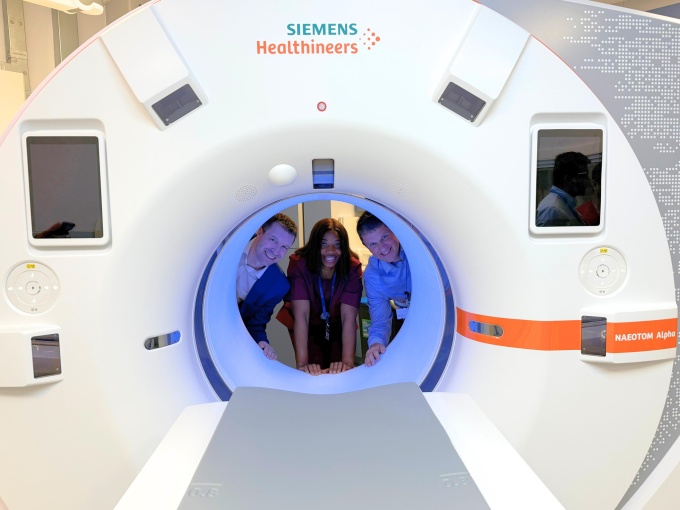 Dr. Christopher Clarke, Cynthia Okonkwo, and Matthew Dunn standing inside the...