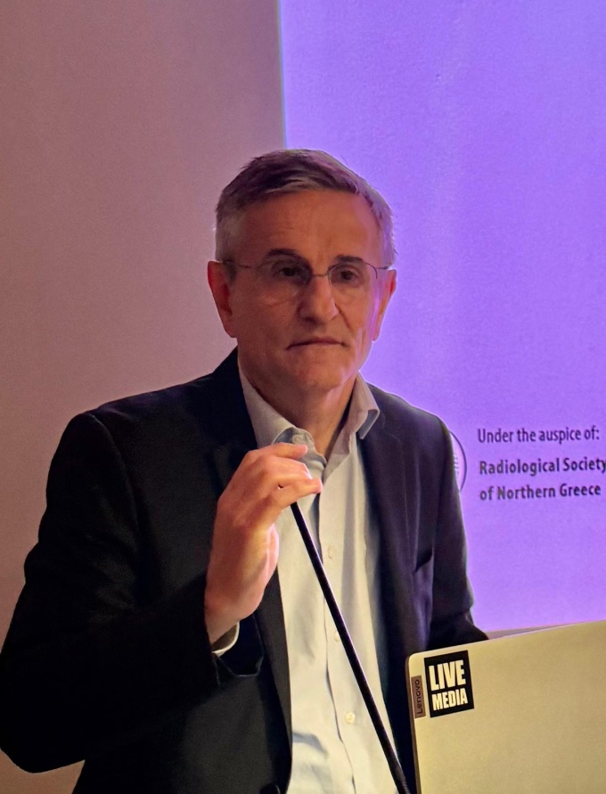 Man talking at an event: Dr. Jean-François Paul