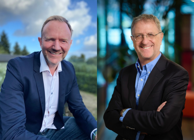 Peter Ulvskjold (left) and Didier Hans (right) smiling into the camera....