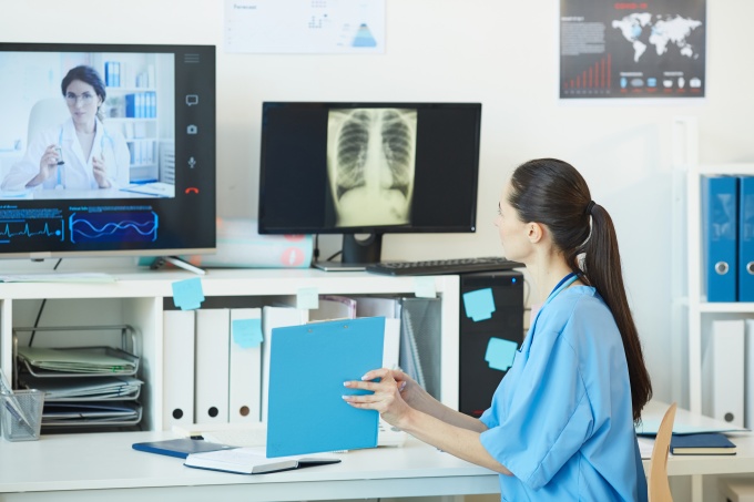Clinical staff talking via telecommunication