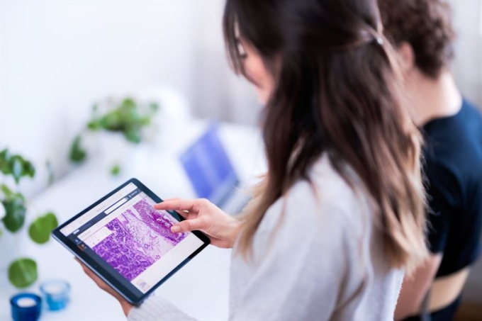 A woman is using a tablet