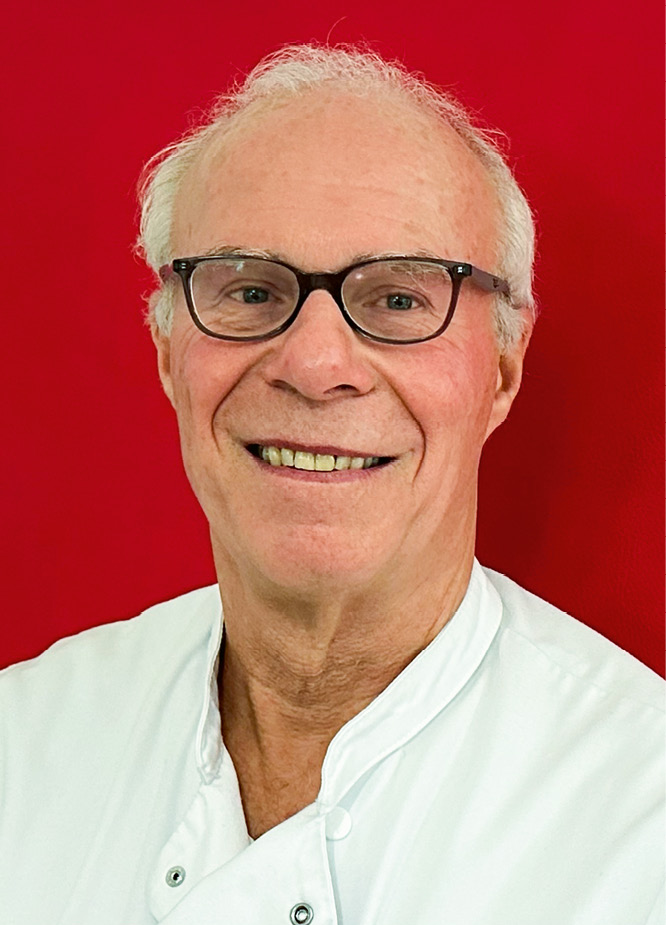 Dr. Martin Wasser smiles into the Camera.